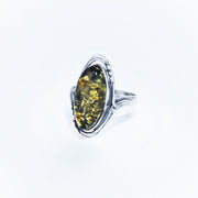 Amber ring with 18x10 mm green amber in sterling silver (925)